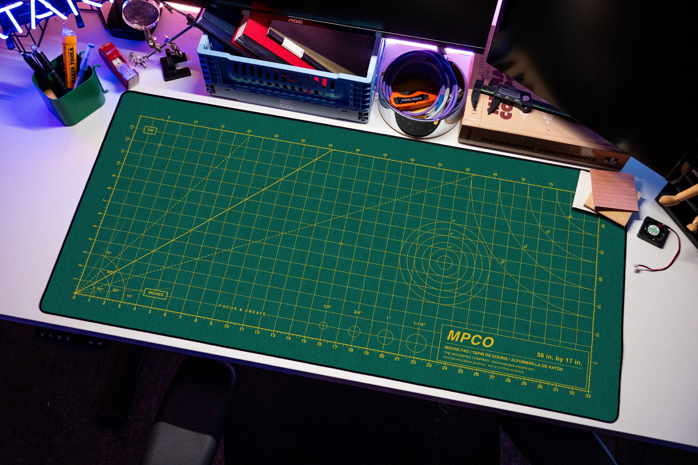 Draftpad desk mat in Green / Yellow, shown on a styled desk setup
