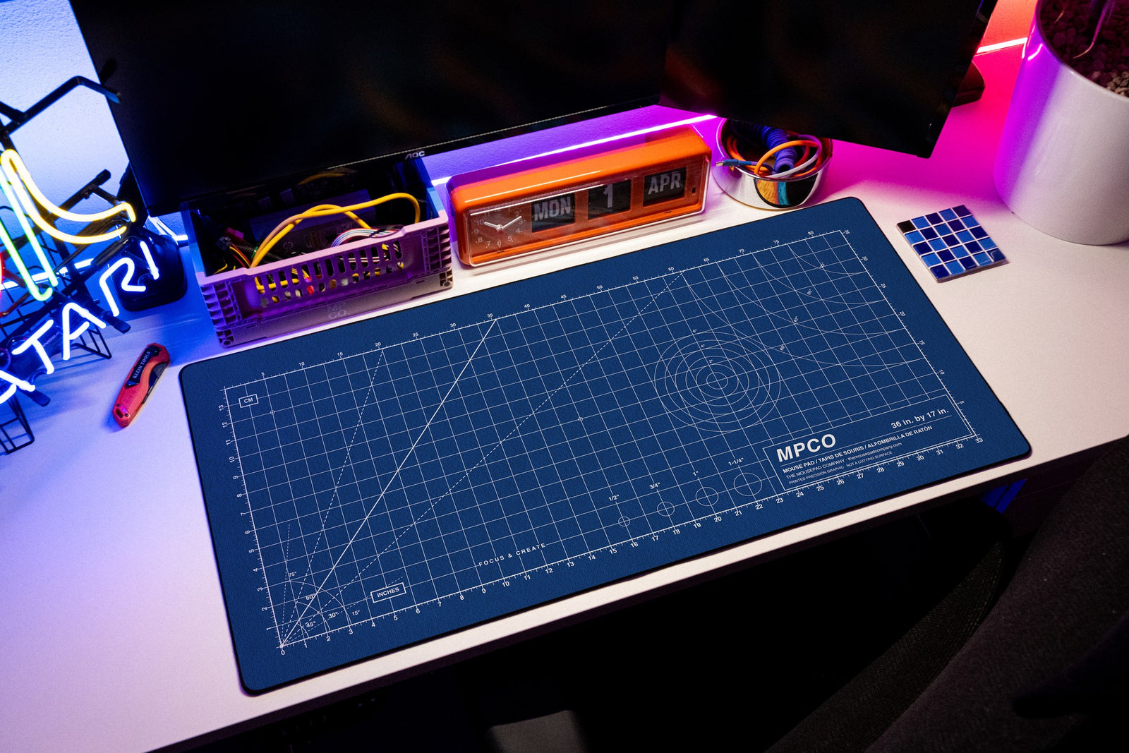 Draftpad desk mat in Blue / White, shown on a styled desk setup