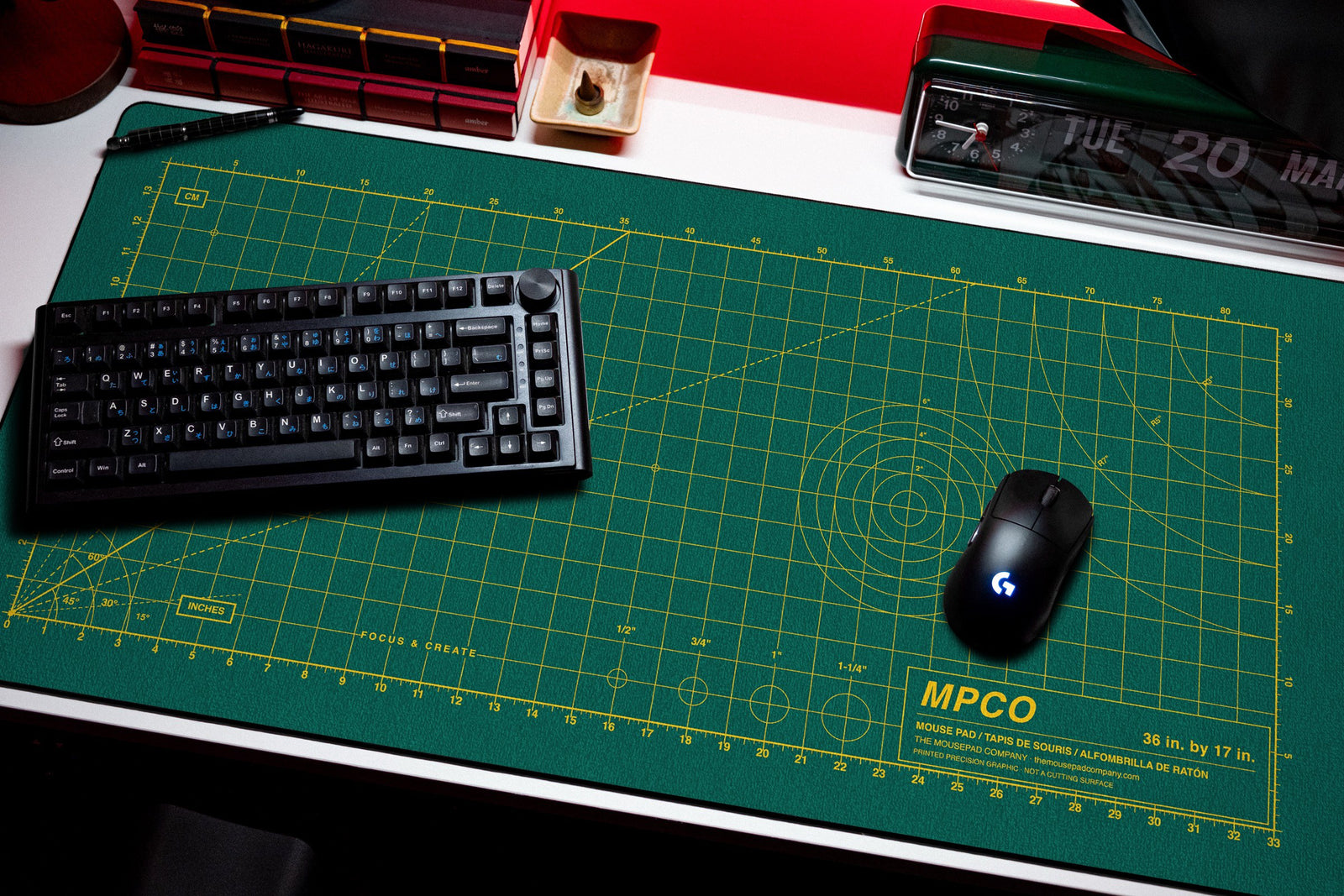 Draftpad desk mat in Green / Yellow, shown on a styled desk setup