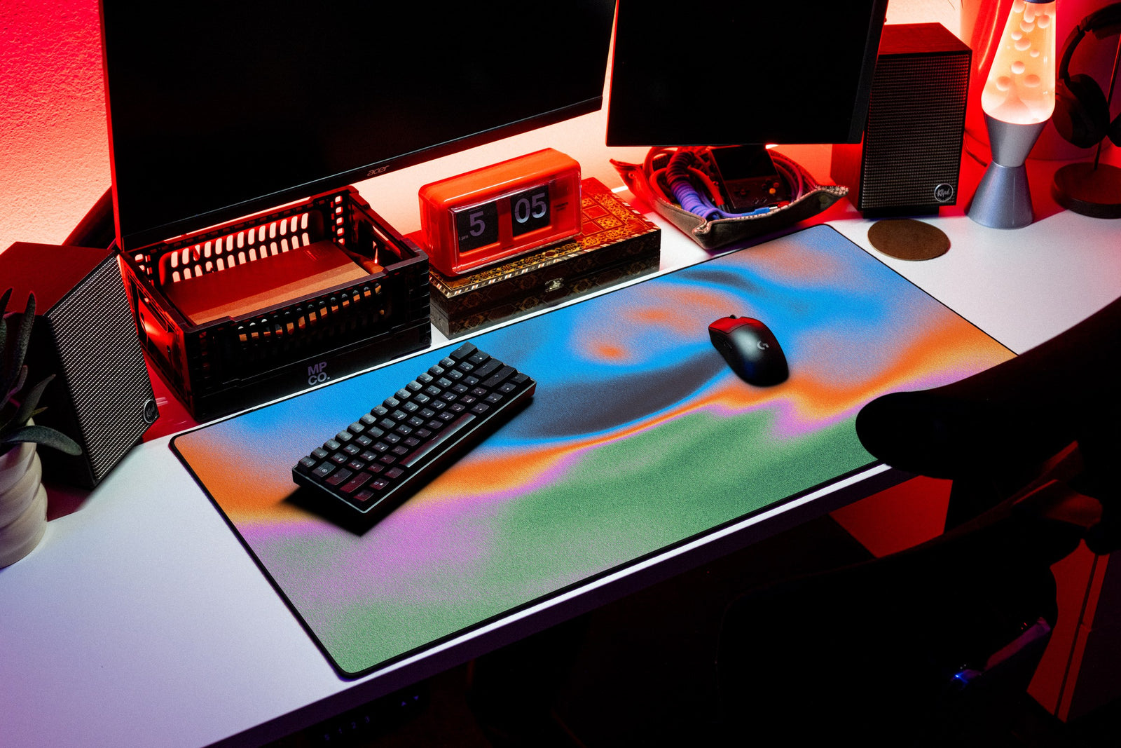 Aura desk mat in Abyss Bloom, shown on a styled desk setup