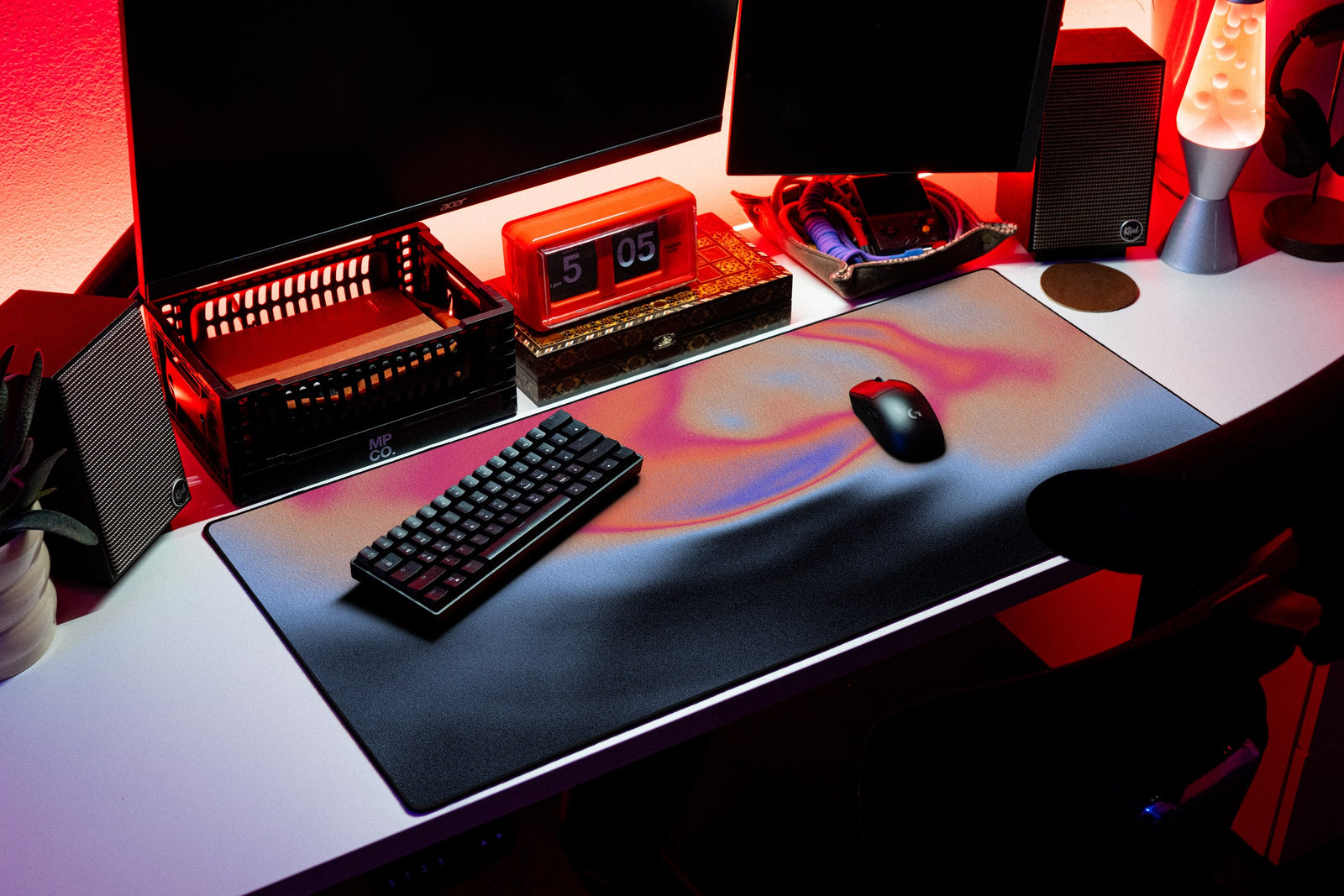 Aura desk mat in Midnight Ember, shown on a styled desk setup