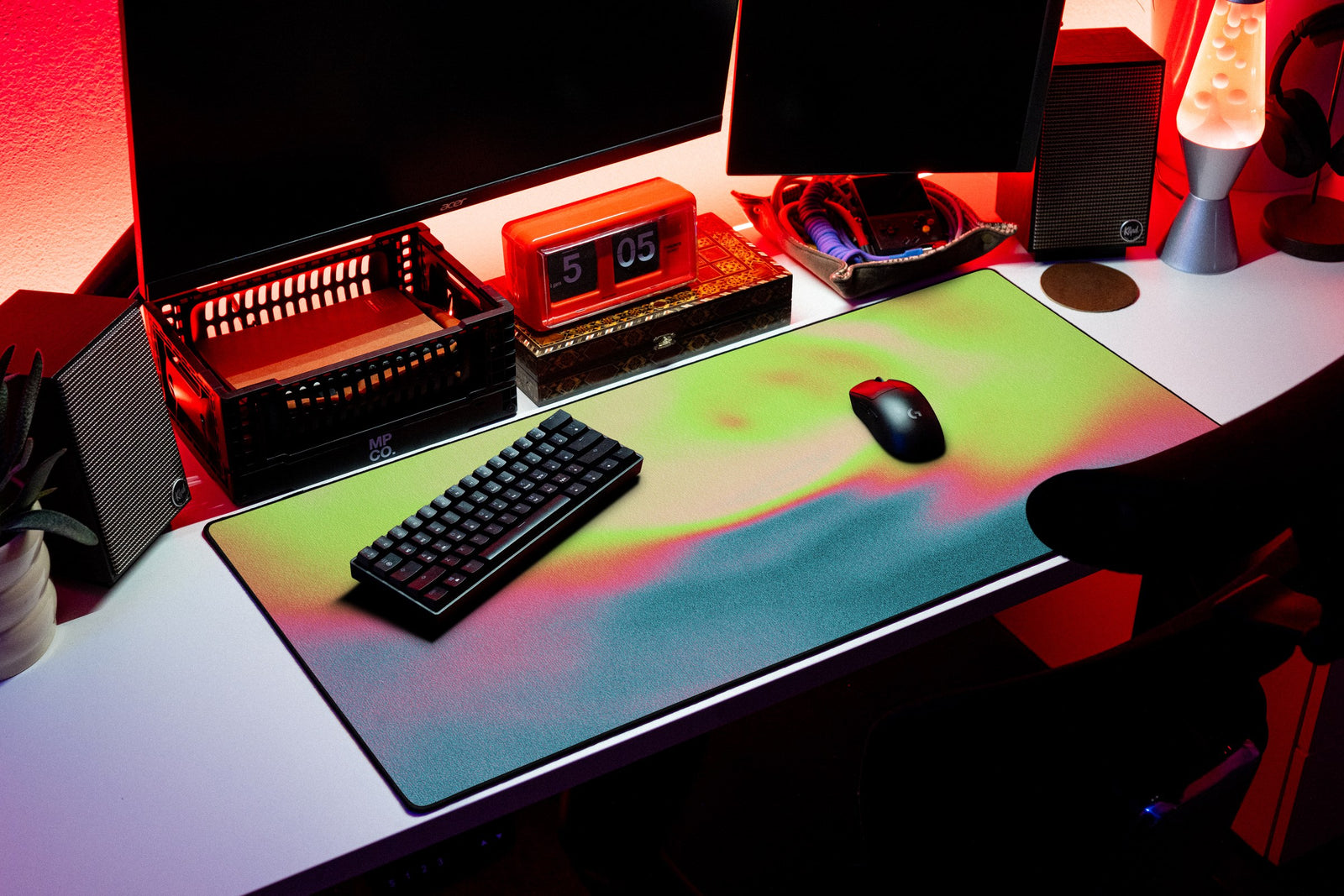 Aura desk mat in Neon Meadow, shown on a styled desk setup