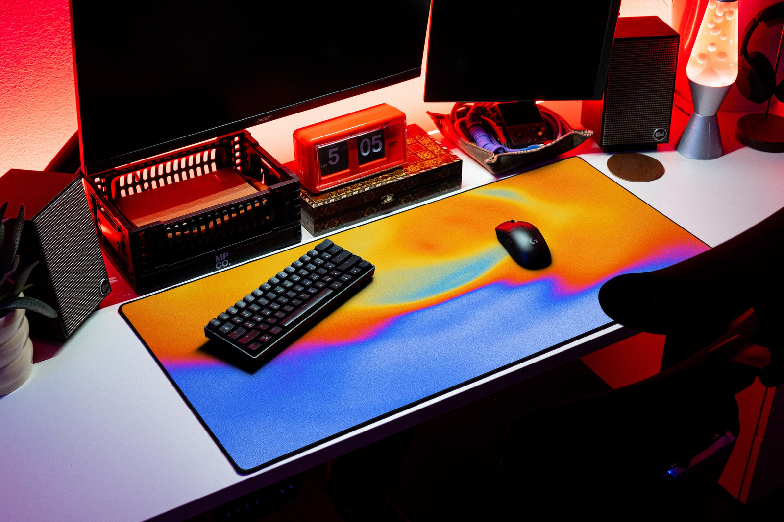 Aura desk mat in Tangerine Sky, shown on a styled desk setup