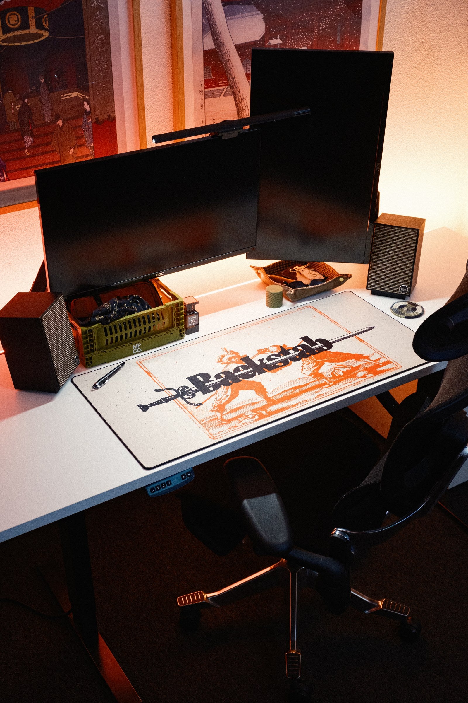 Backstab desk mat in Original, shown on a styled desk setup