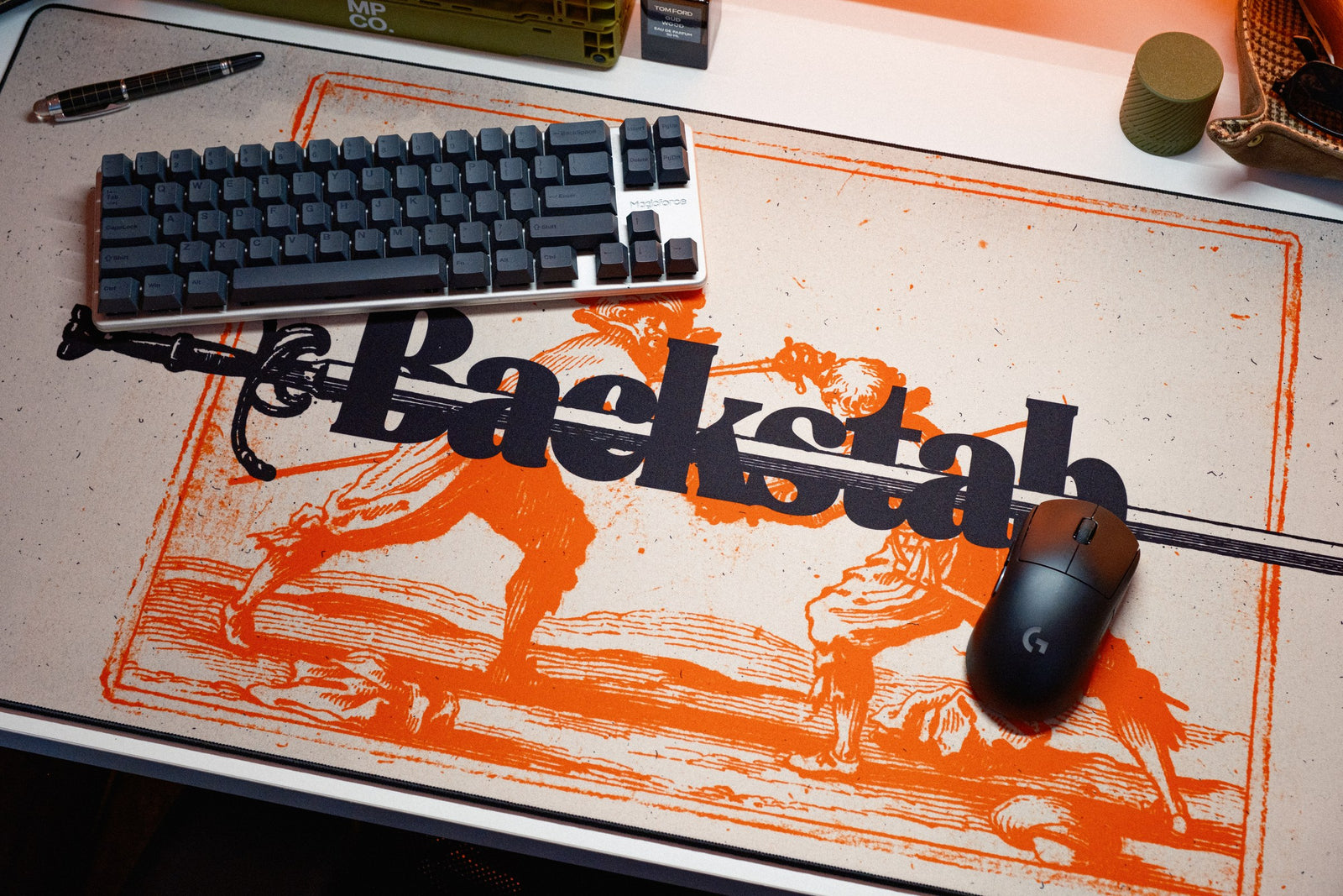 Backstab desk mat in Original, shown on a styled desk setup