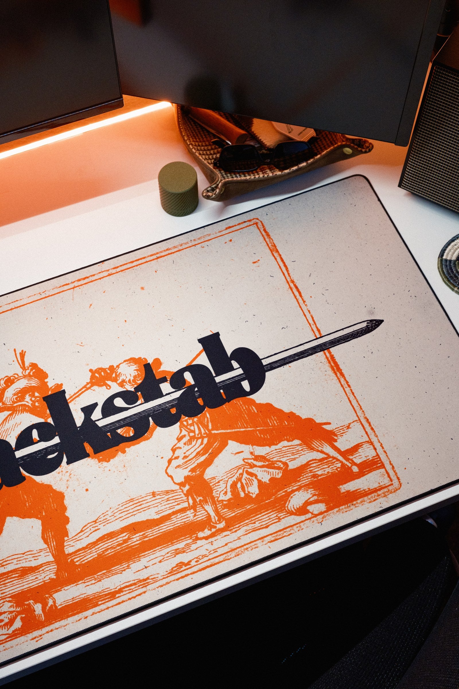Backstab desk mat in Original, shown on a styled desk setup