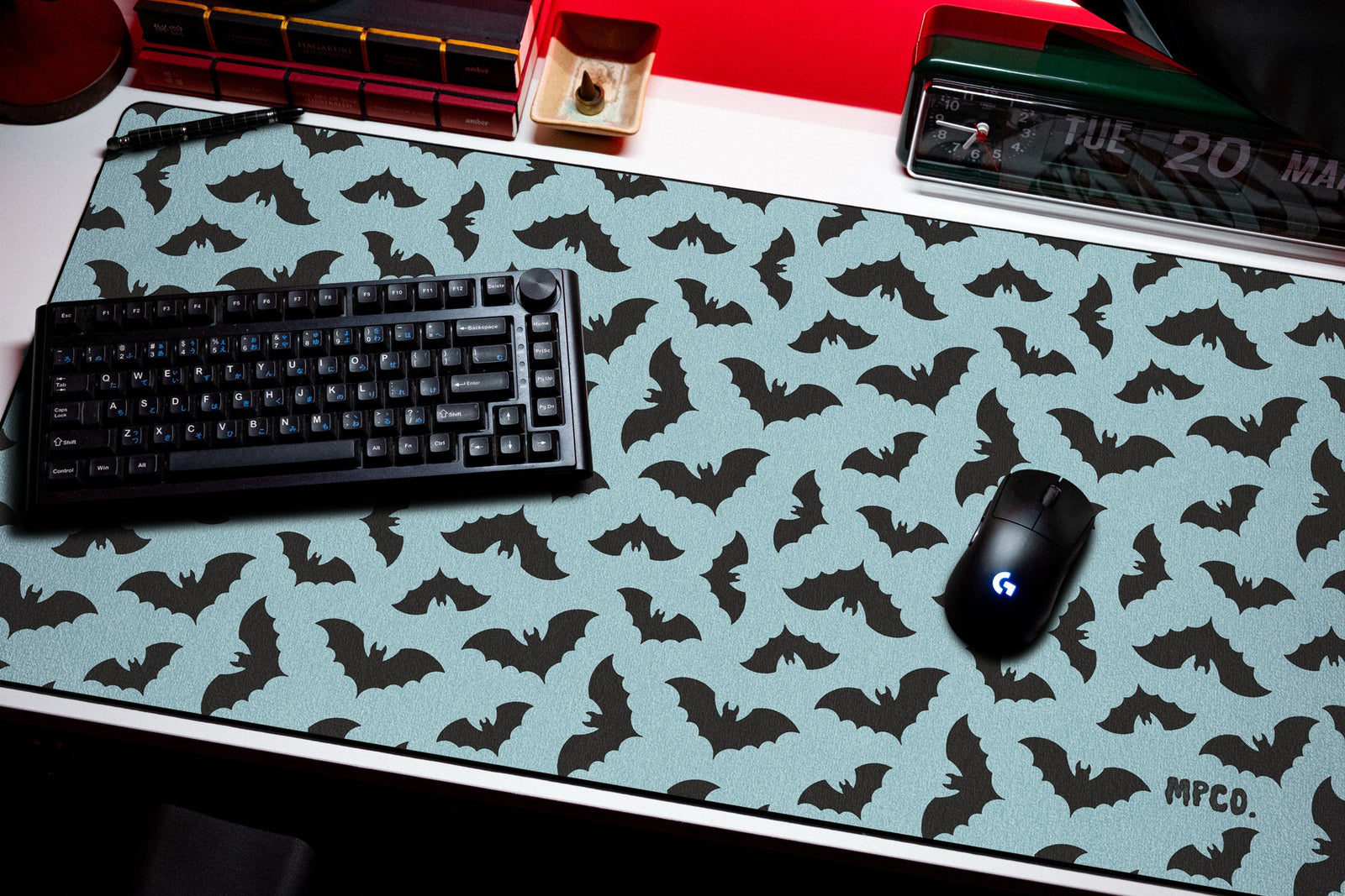 Bats desk mat in Blue, shown on a styled desk setup