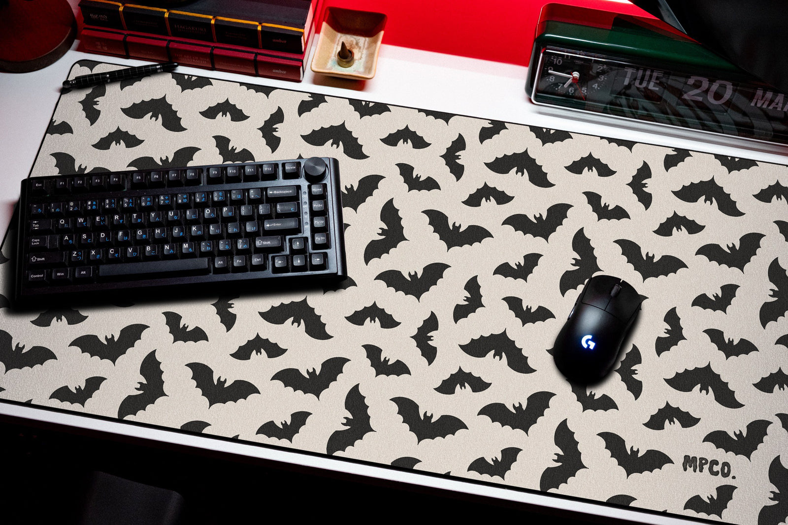 Bats desk mat in Cream, shown on a styled desk setup