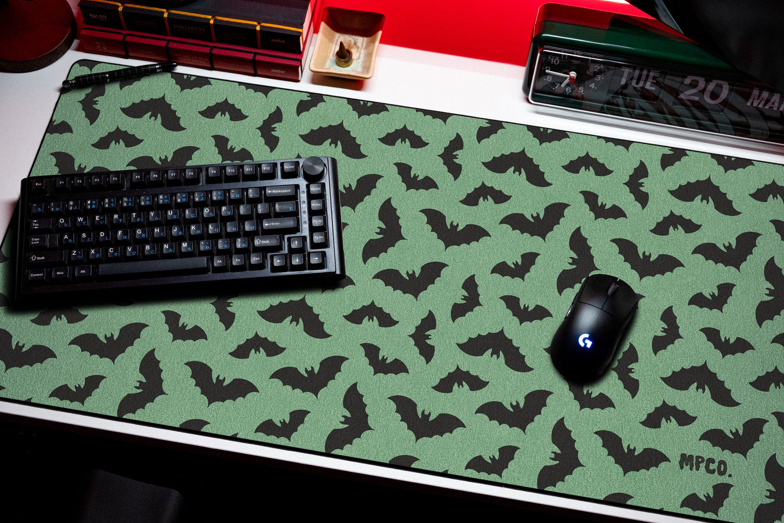 Bats desk mat in Green, shown on a styled desk setup