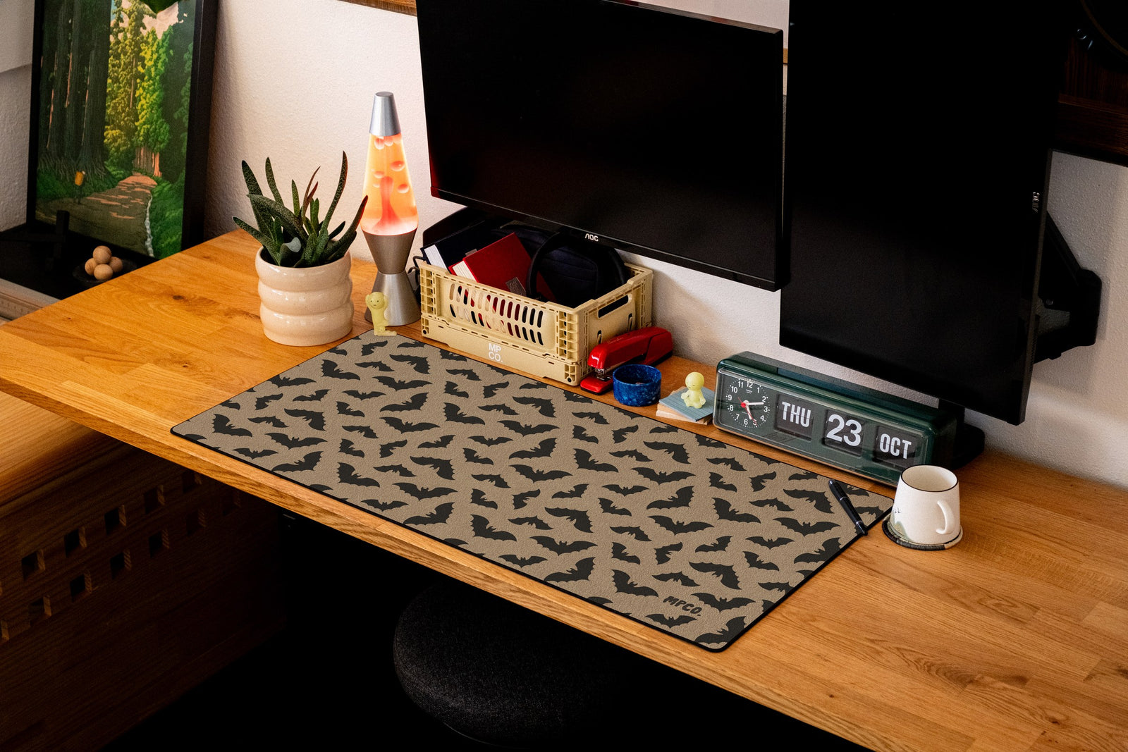 Bats desk mat in Sand, shown on a styled desk setup