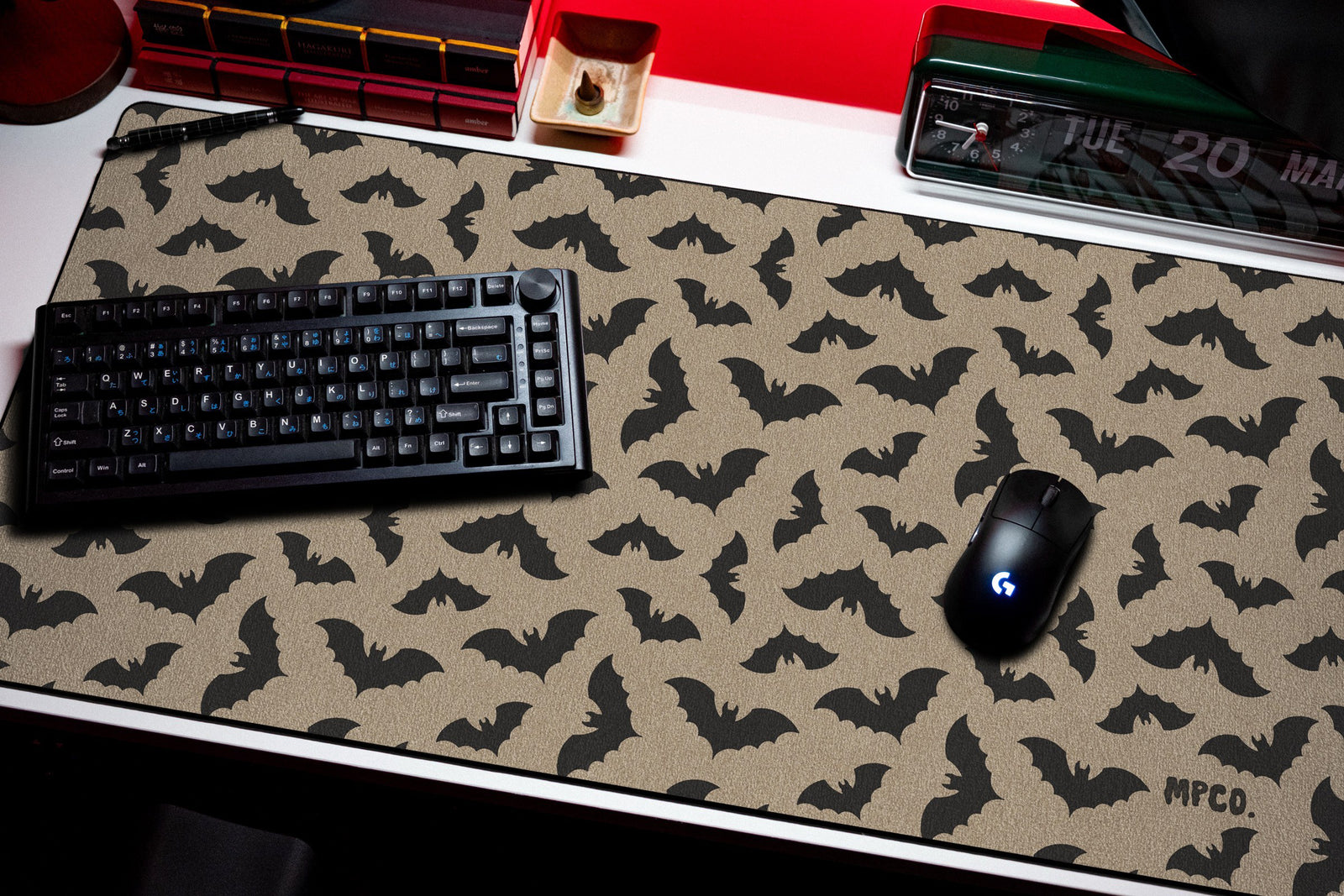 Bats desk mat in Sand, shown on a styled desk setup