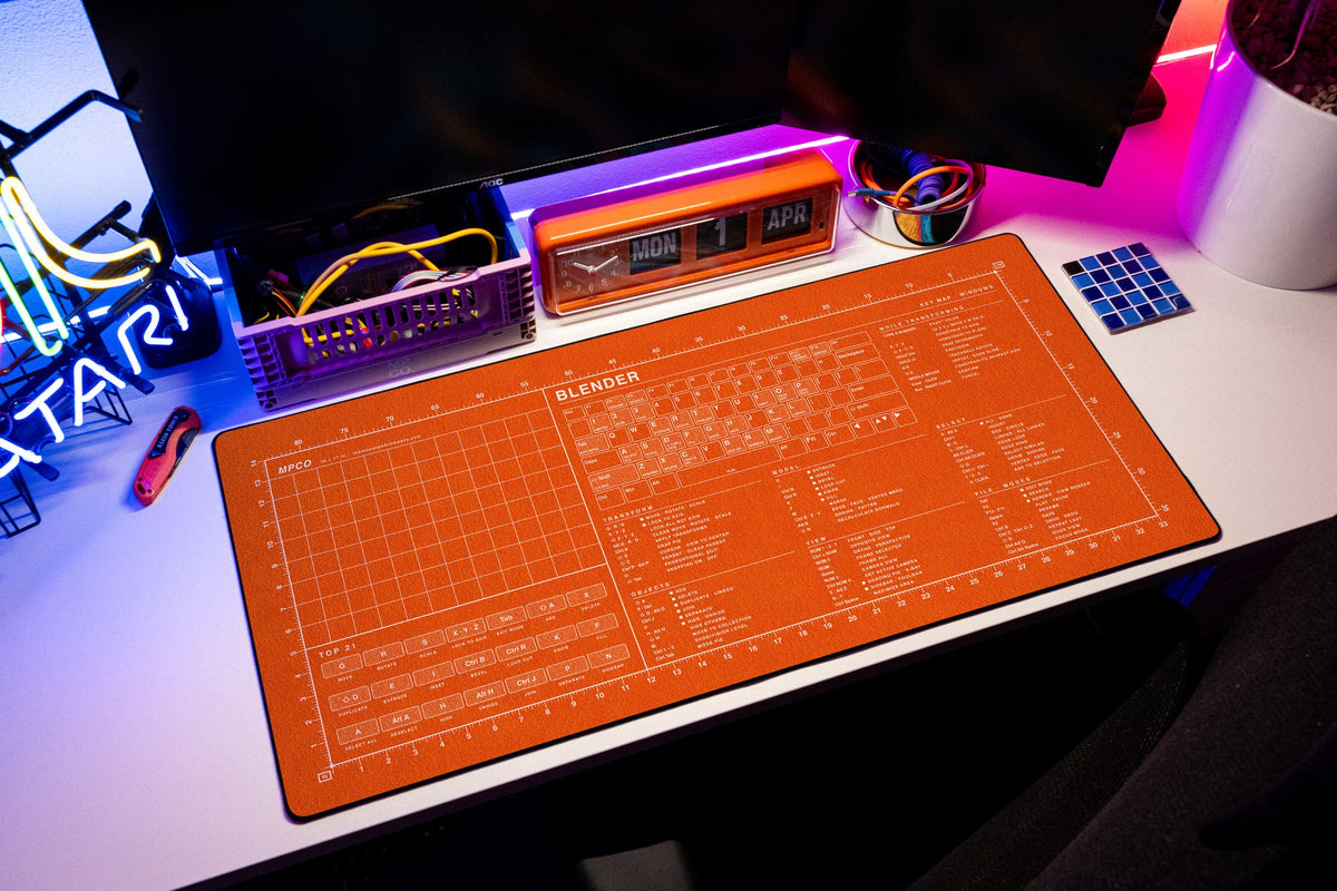 Blender Shortcuts Pad (Windows) desk mat in Orange / White, shown on a styled desk setup