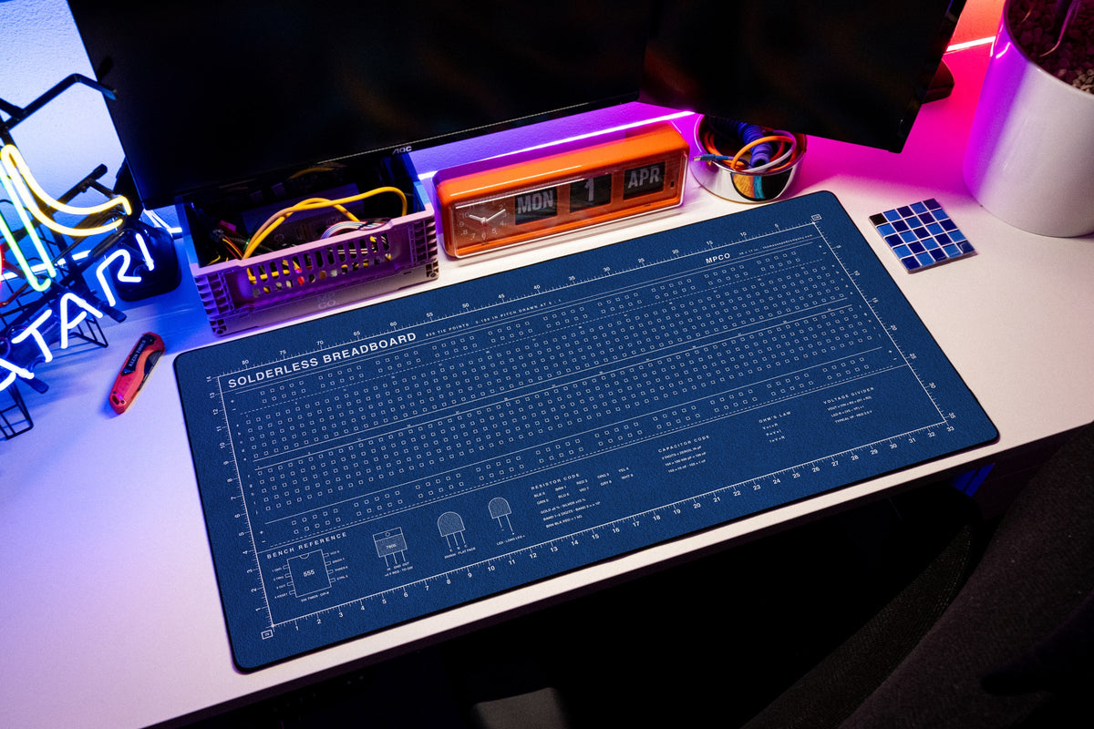 Breadboard Pad desk mat in Blue / White, shown on a styled desk setup