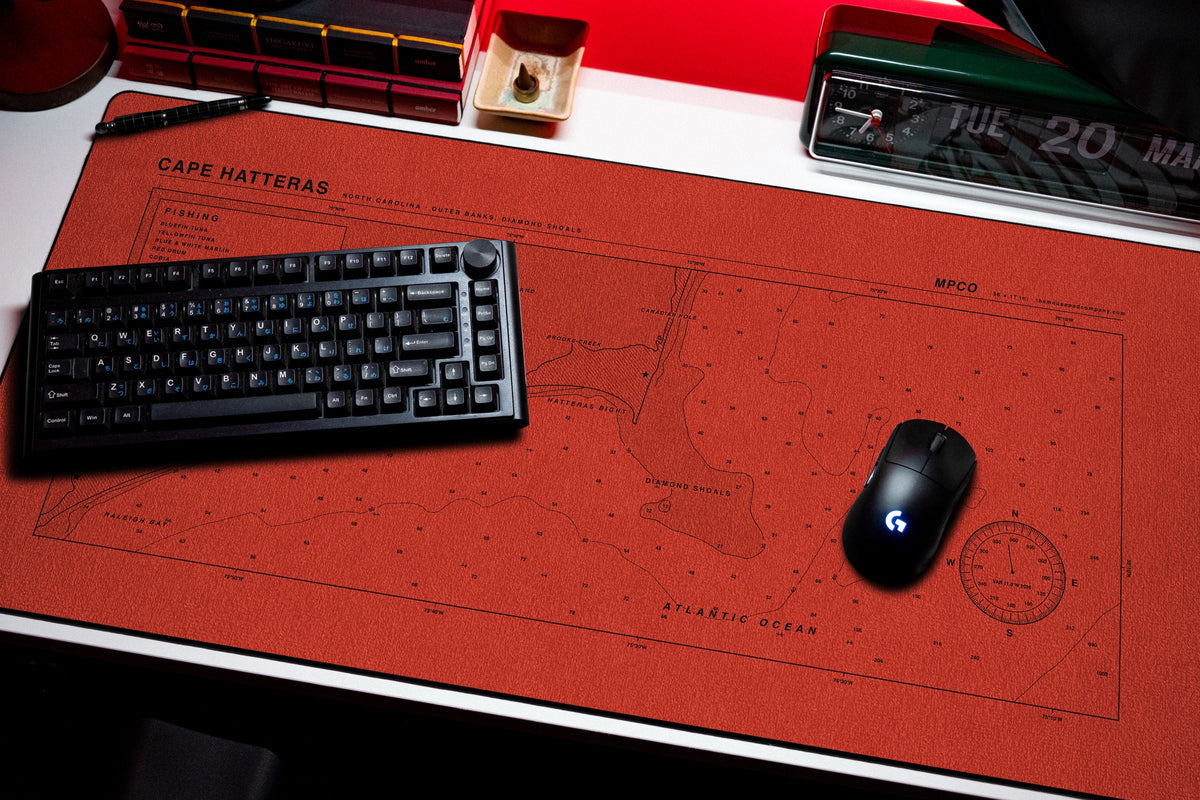Cape Hatteras Nautical Chart Pad desk mat in Red / Black, shown on a styled desk setup