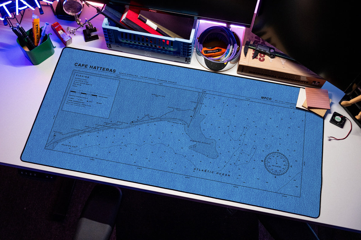 Cape Hatteras Nautical Chart Pad desk mat in Swiss Blue, shown on a styled desk setup