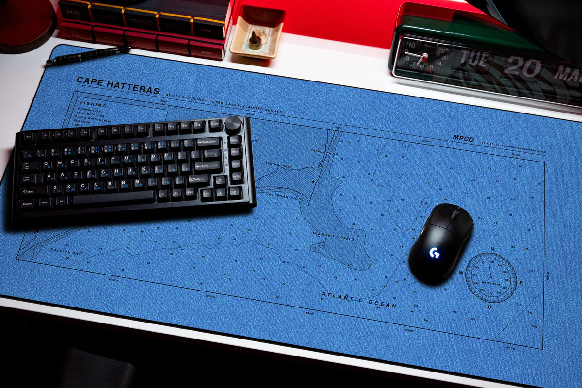 Cape Hatteras Nautical Chart Pad desk mat in Swiss Blue, shown on a styled desk setup