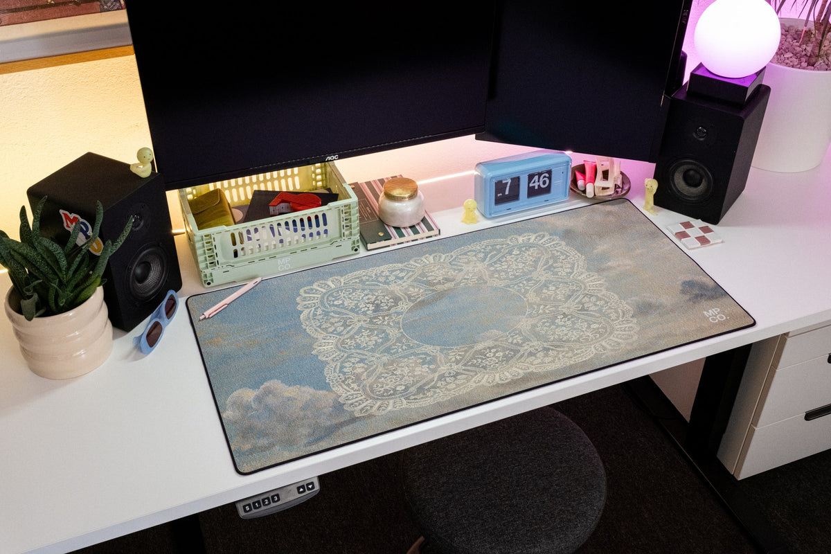 Celeste desk mat in Blue Sky, shown on a styled desk setup