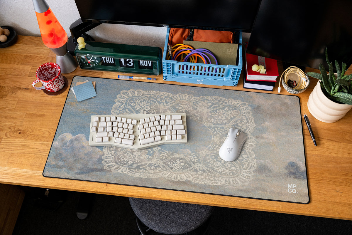 Celeste desk mat in Blue Sky, shown on a styled desk setup