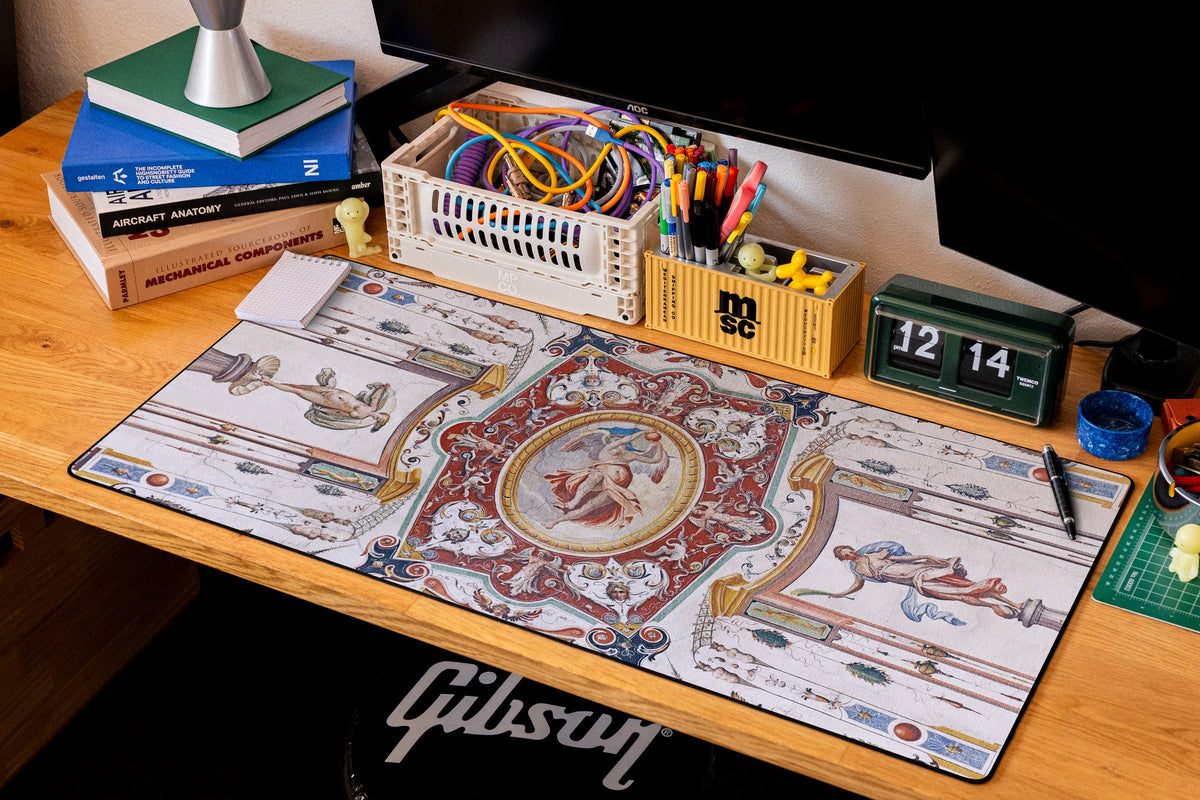 Celestial Messenger desk mat in Original, shown on a styled desk setup