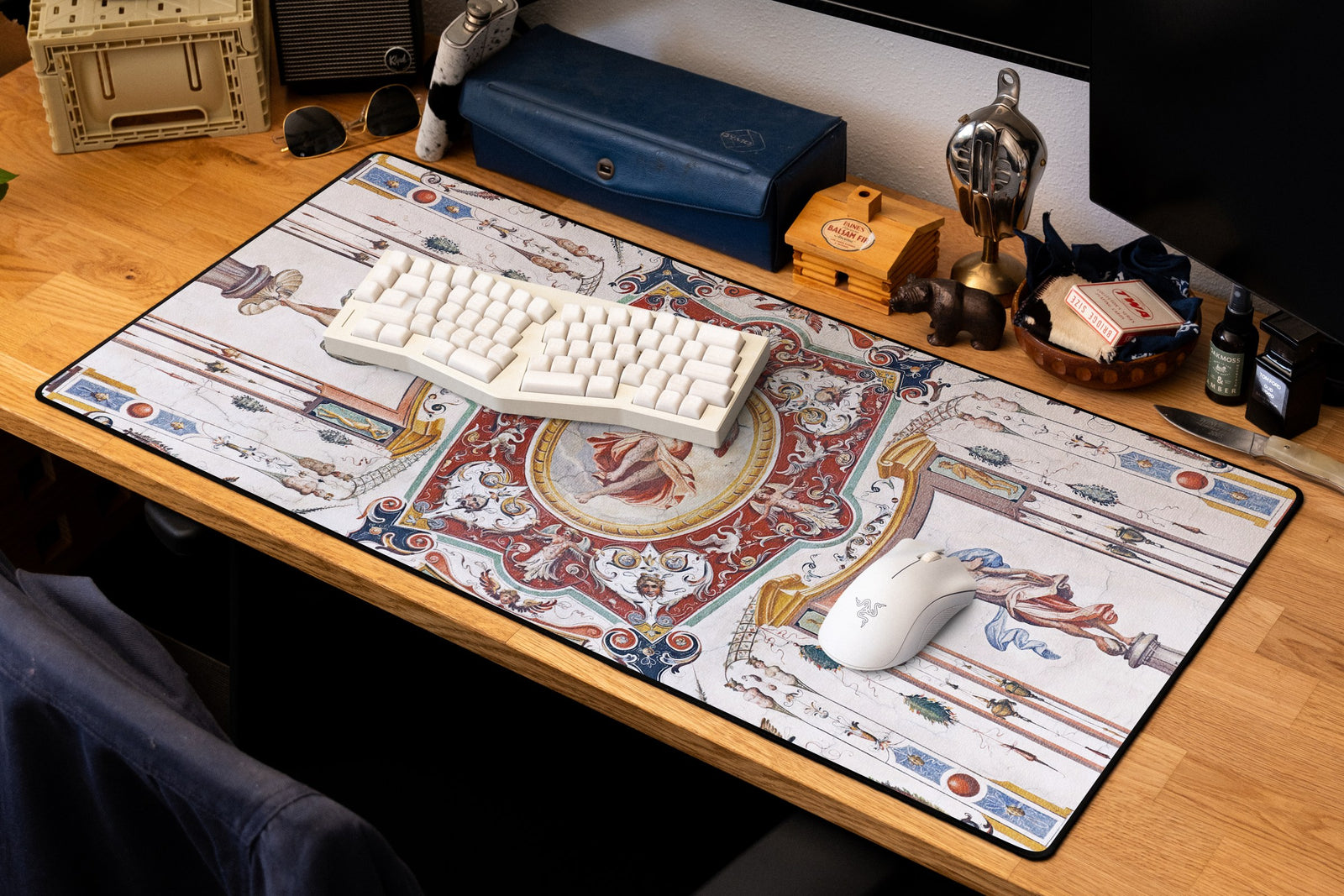 Celestial Messenger desk mat in Original, shown on a styled desk setup