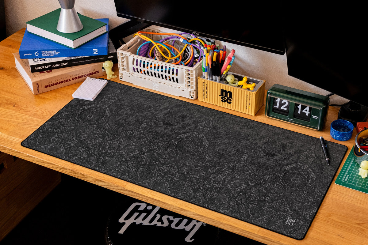 Chantilly desk mat in Black, shown on a styled desk setup