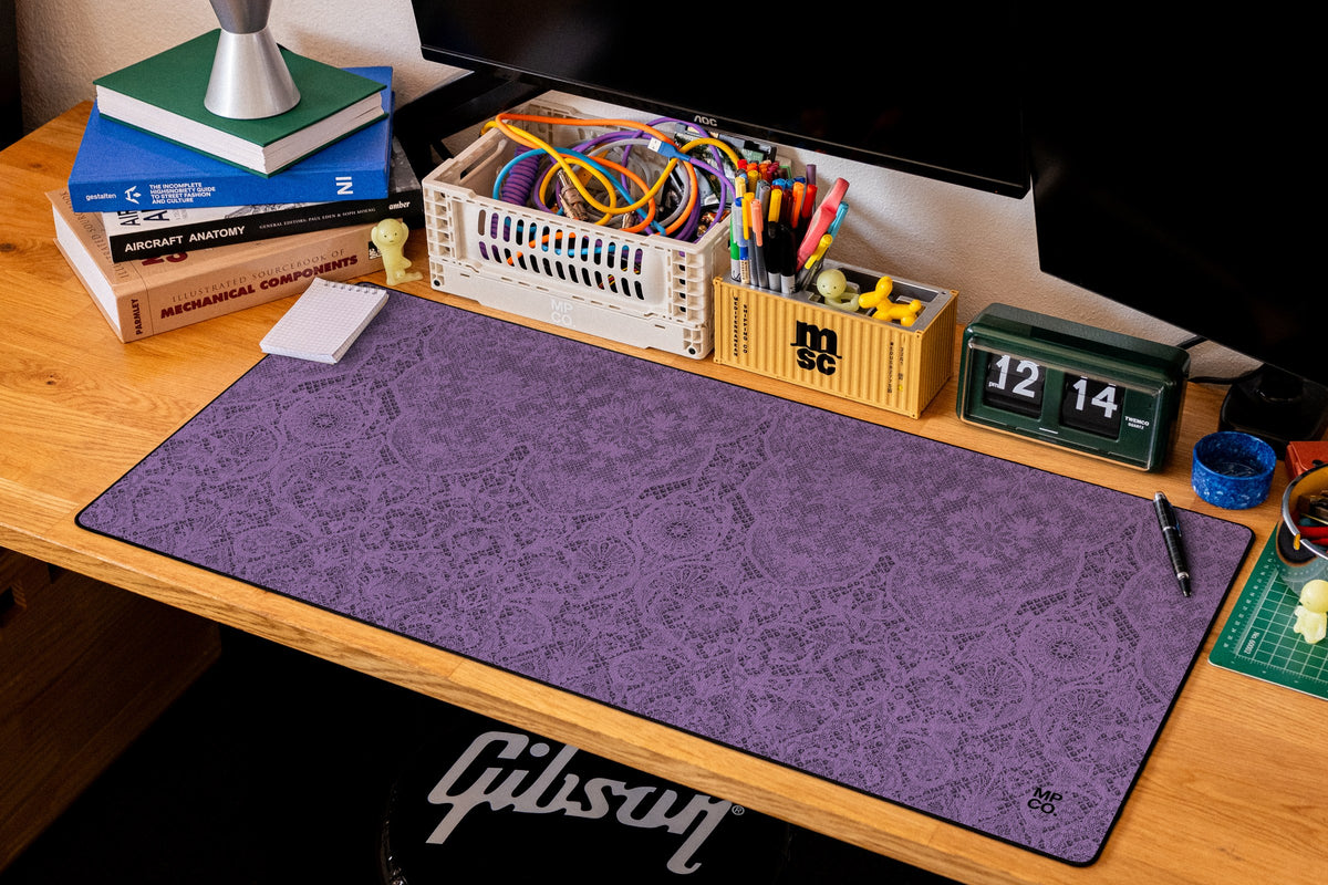 Chantilly desk mat in Purple, shown on a styled desk setup