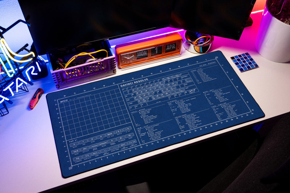 DaVinci Resolve Shortcuts Pad (Windows) desk mat in Blue / White, shown on a styled desk setup