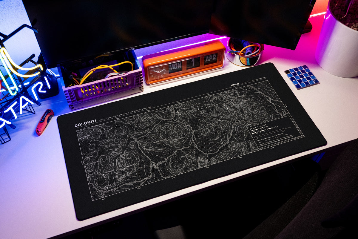 Dolomites Topo Pad desk mat in Black / White, shown on a styled desk setup