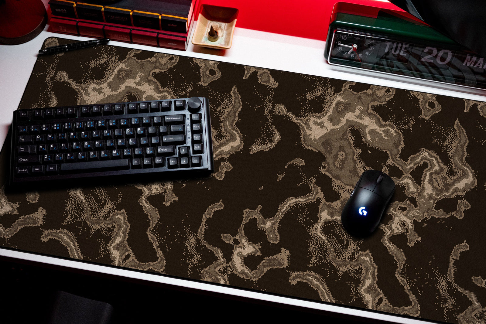 Ember desk mat in Brown, shown on a styled desk setup
