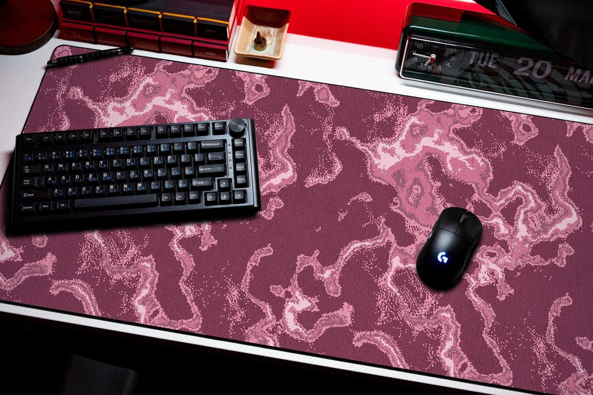 Ember desk mat in Pink, shown on a styled desk setup