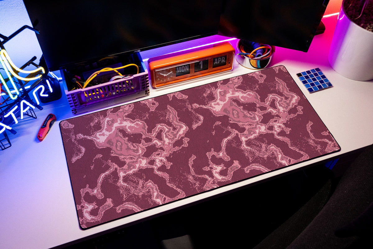 Ember desk mat in Pink, shown on a styled desk setup