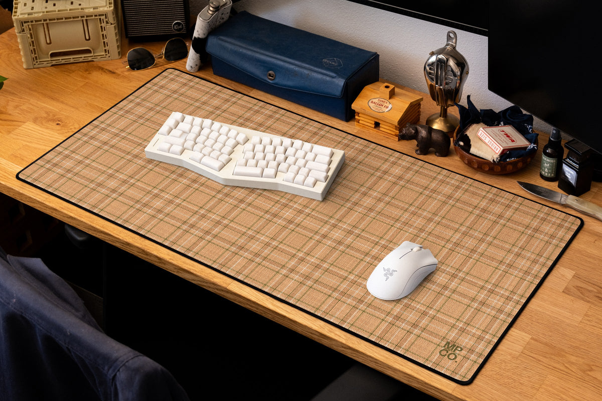 Flannel Plaids 2026 Fall desk mat in Apricot, shown on a styled desk setup
