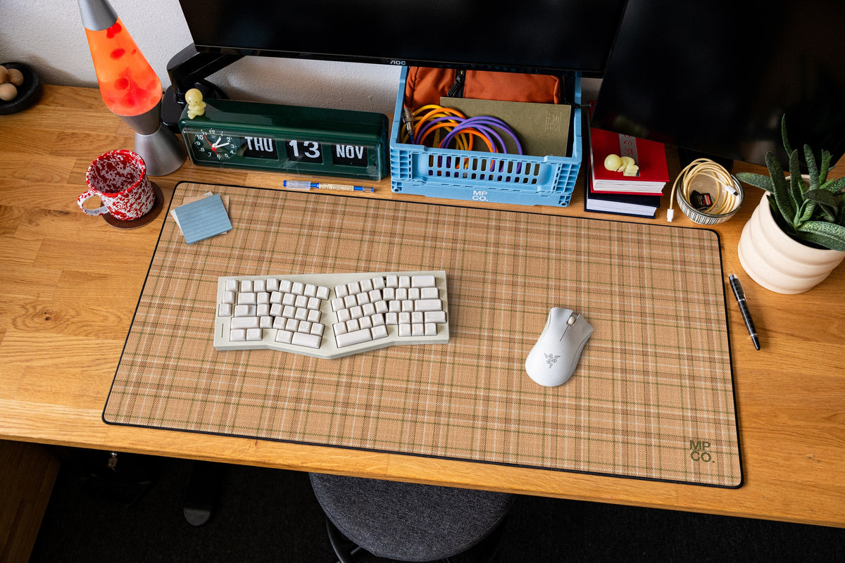 Flannel Plaids 2026 Fall desk mat in Apricot, shown on a styled desk setup