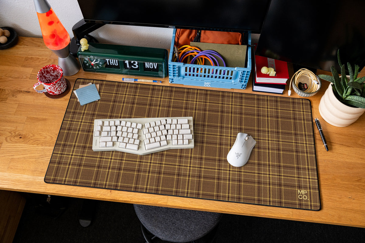 Flannel Plaids 2026 Fall desk mat in Caramel, shown on a styled desk setup