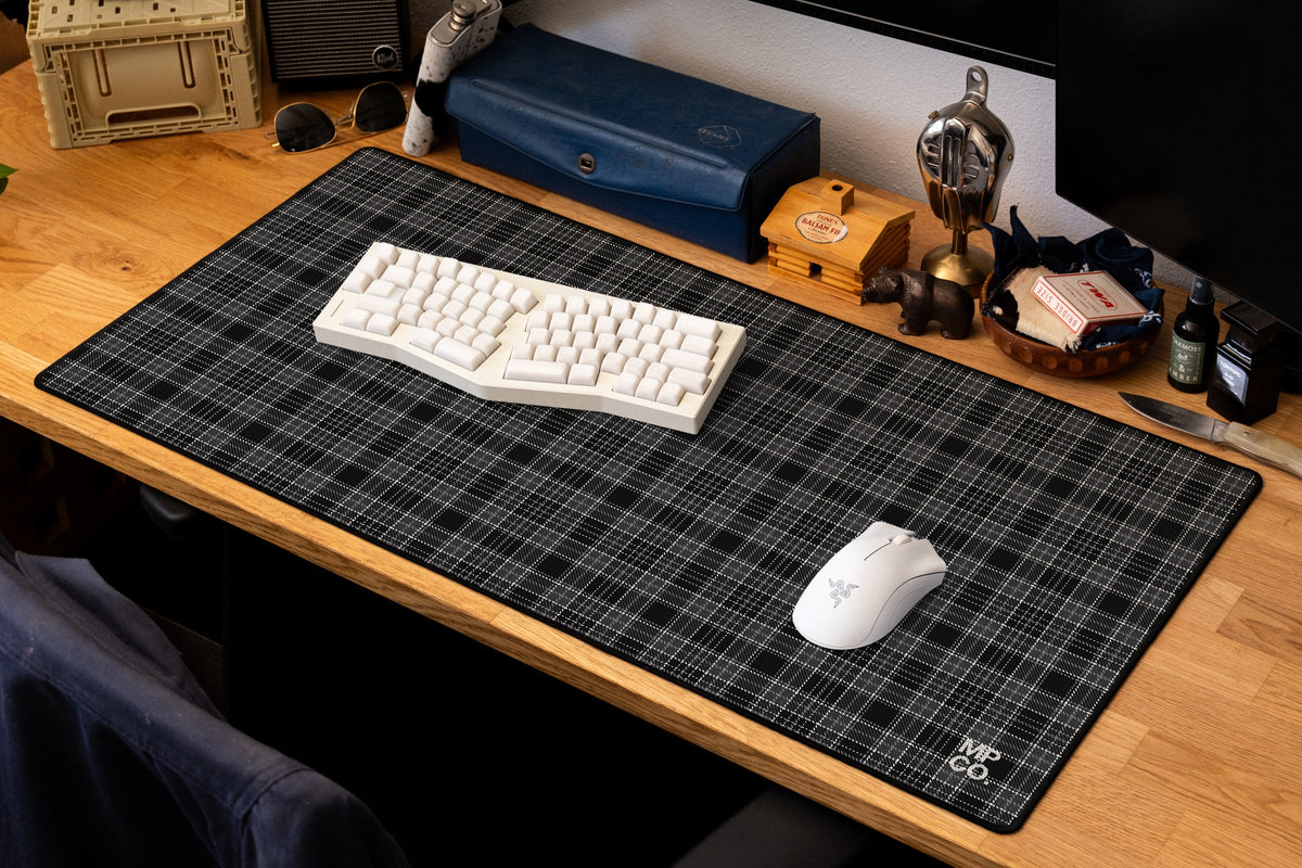 Flannel Plaids 2026 Fall desk mat in Charcoal, shown on a styled desk setup