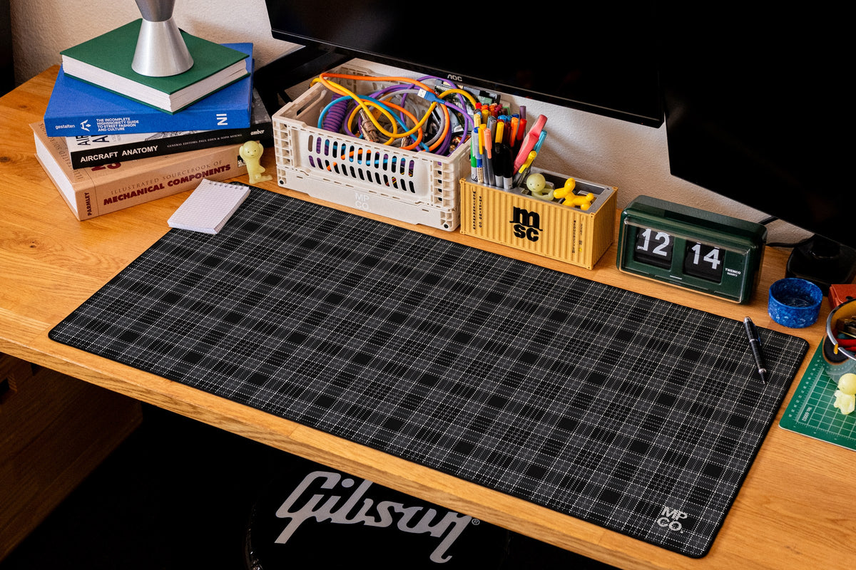 Flannel Plaids 2026 Fall desk mat in Charcoal, shown on a styled desk setup