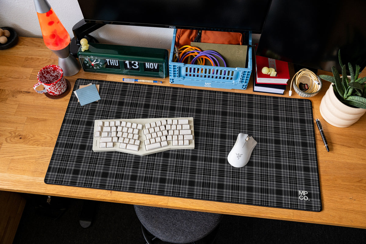Flannel Plaids 2026 Fall desk mat in Charcoal, shown on a styled desk setup