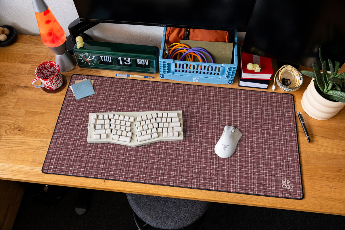 Flannel Plaids 2026 Fall desk mat in Mauve, shown on a styled desk setup