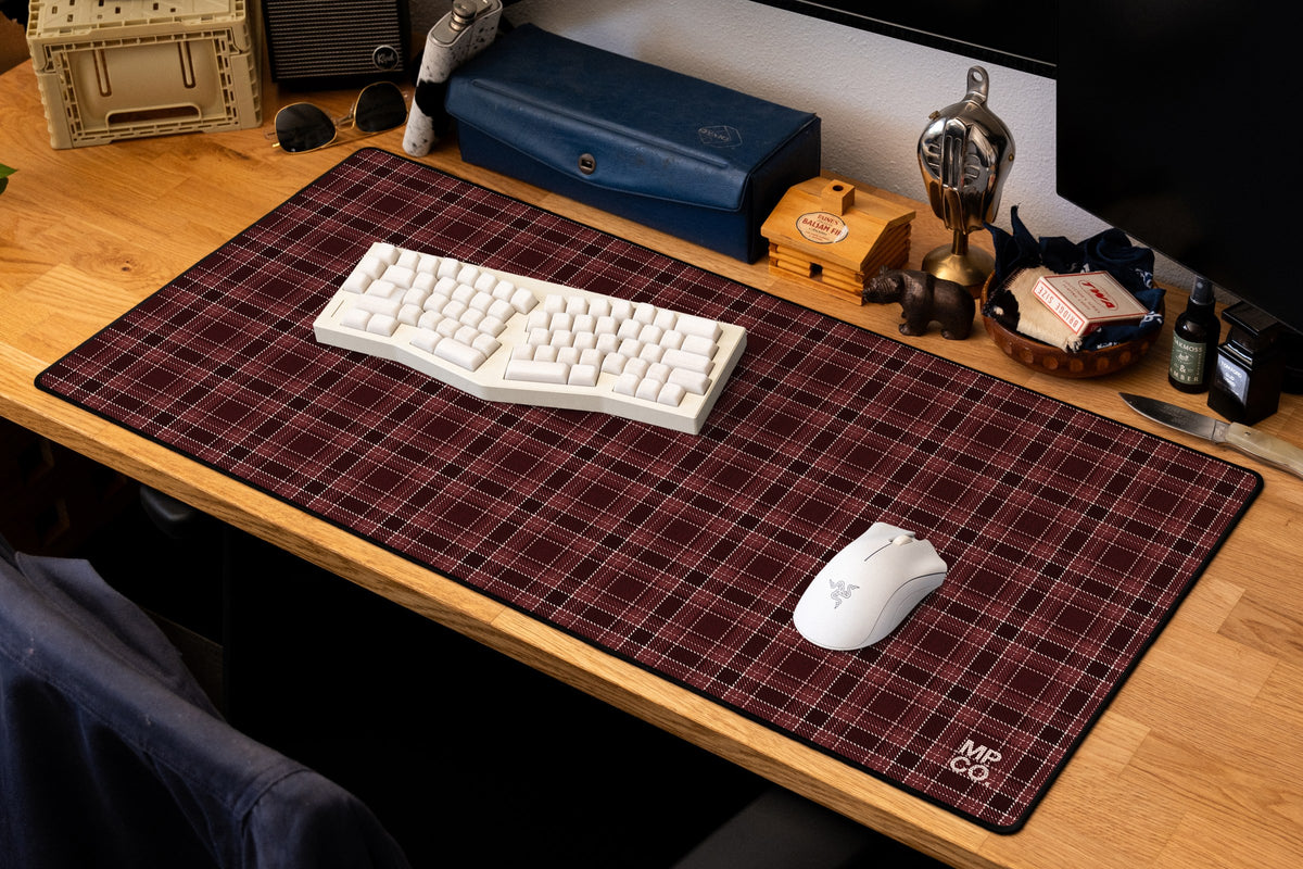 Flannel Plaids 2026 Fall desk mat in Oxblood, shown on a styled desk setup