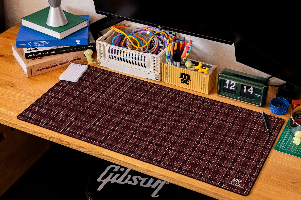 Flannel Plaids 2026 Fall desk mat in Oxblood, shown on a styled desk setup