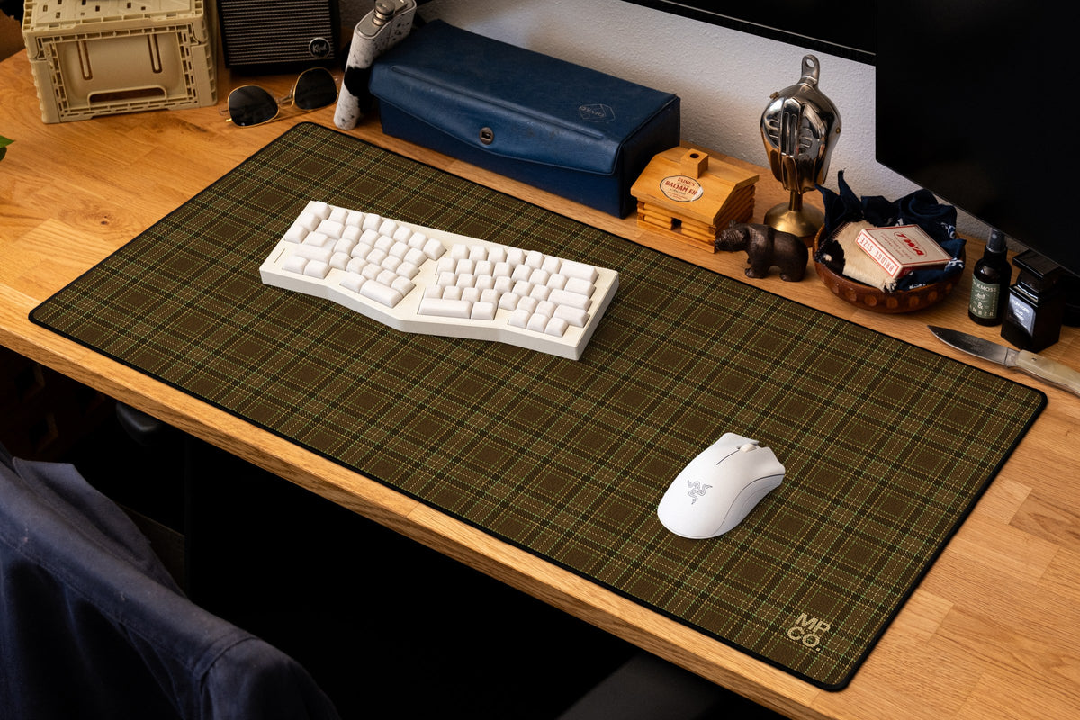 Flannel Plaids 2026 Fall desk mat in Tobacco, shown on a styled desk setup