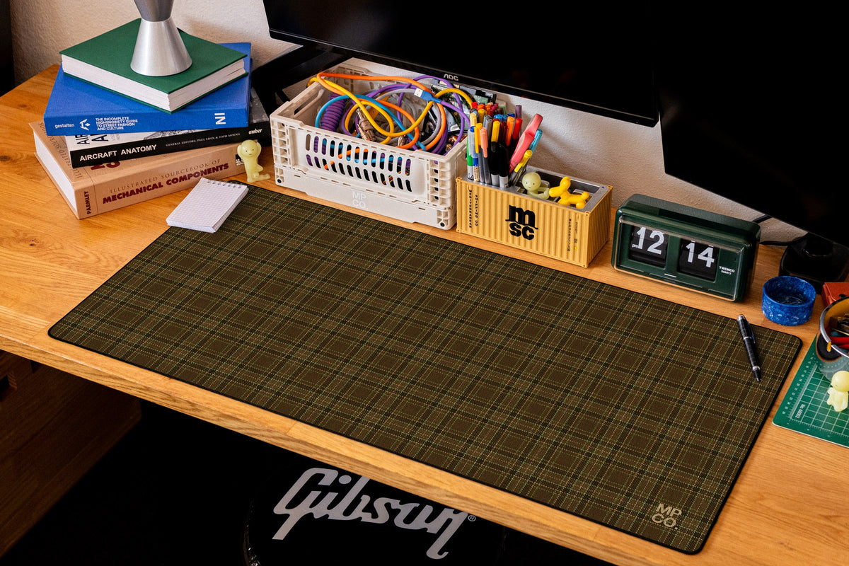 Flannel Plaids 2026 Fall desk mat in Tobacco, shown on a styled desk setup