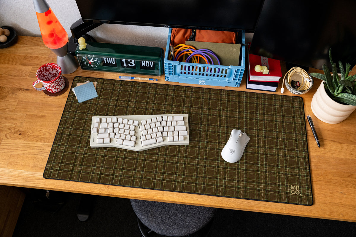 Flannel Plaids 2026 Fall desk mat in Tobacco, shown on a styled desk setup