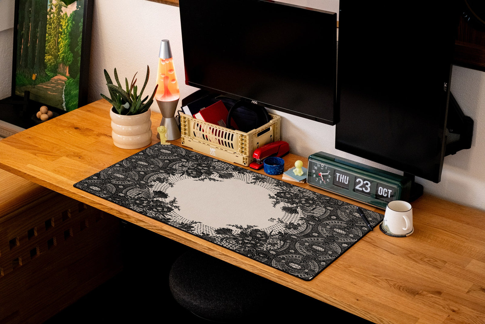Floral Lace desk mat in Black, shown on a styled desk setup