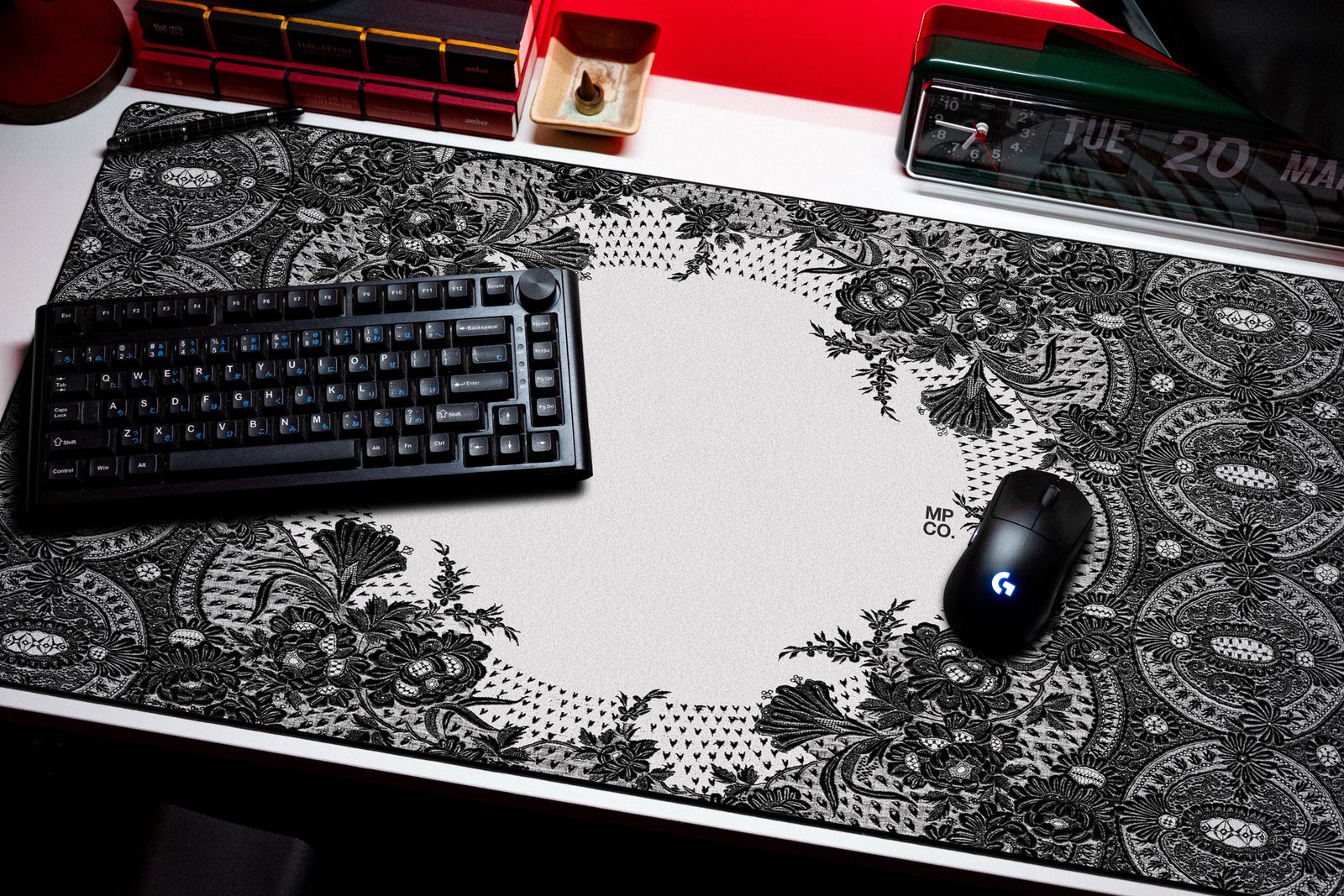 Floral Lace desk mat in Black, shown on a styled desk setup
