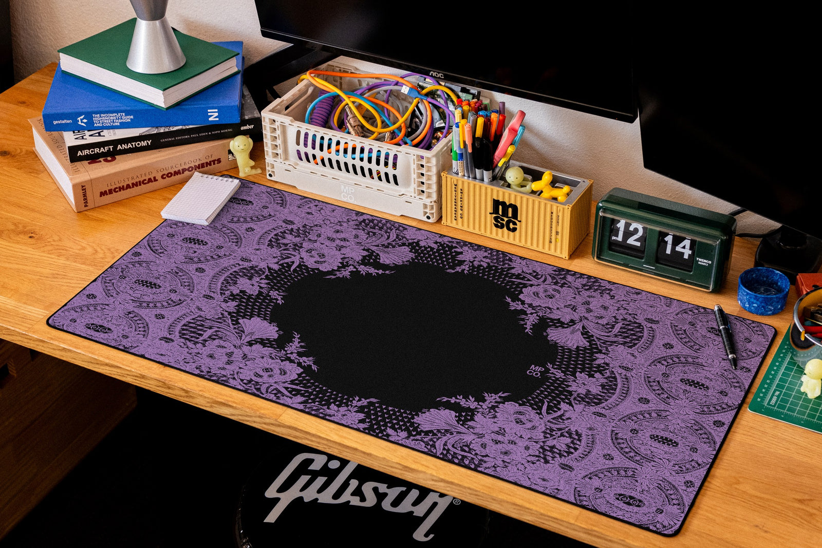 Floral Lace desk mat in Purple, shown on a styled desk setup