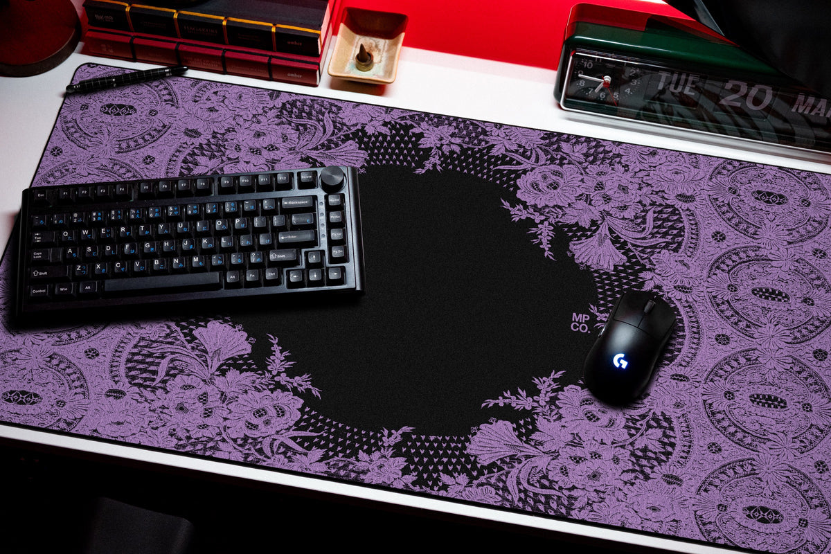 Floral Lace desk mat in Purple, shown on a styled desk setup