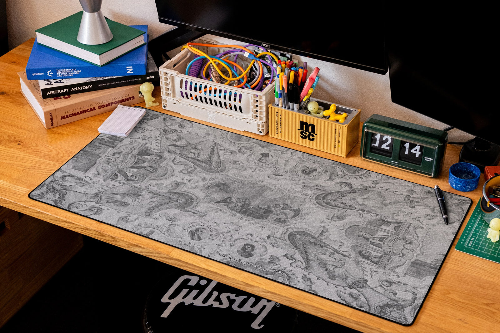 Florentine Ambassadors desk mat in Dark, shown on a styled desk setup