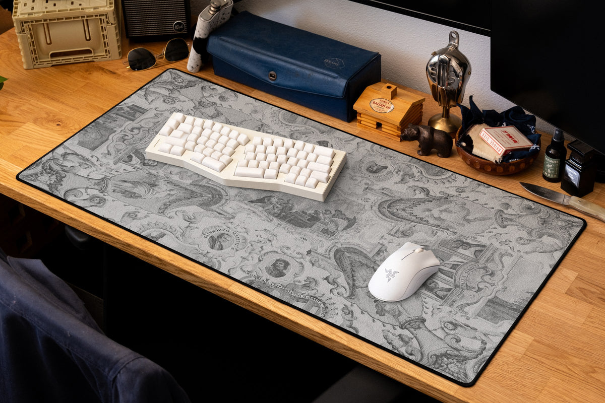 Florentine Ambassadors desk mat in Dark, shown on a styled desk setup