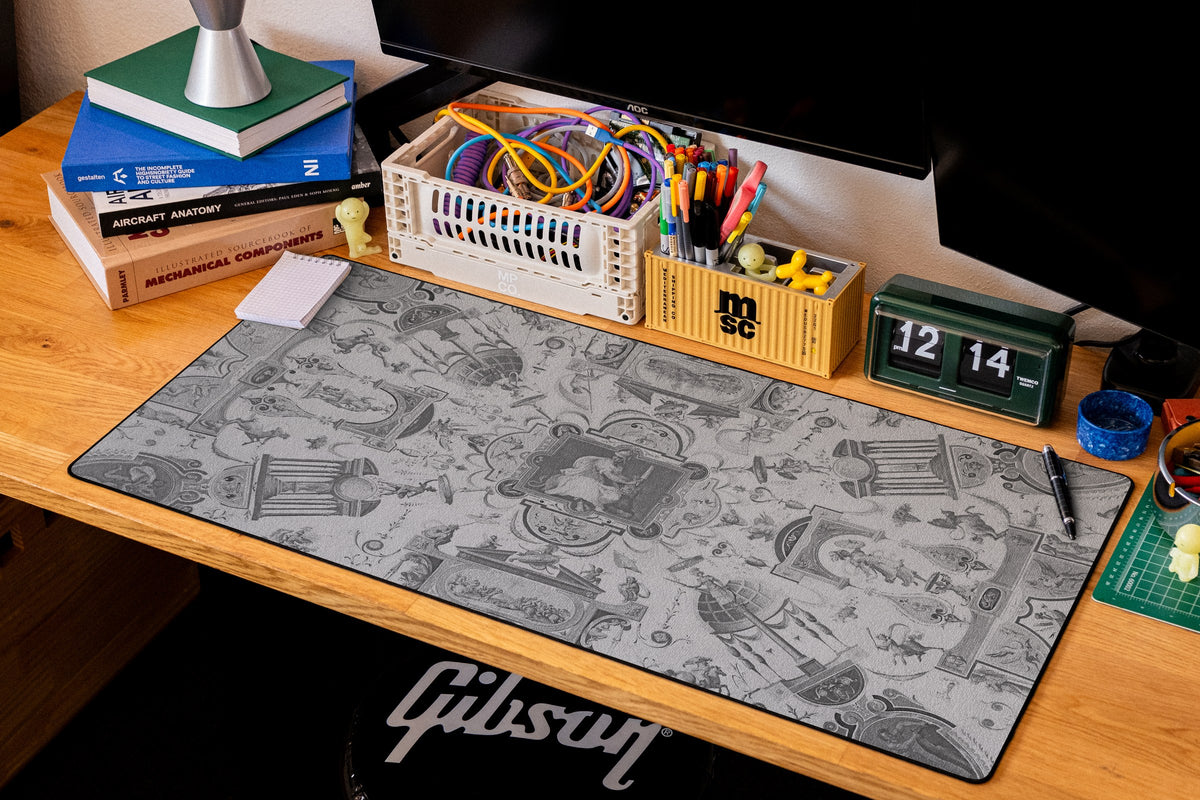 Fortitude desk mat in Dark, shown on a styled desk setup